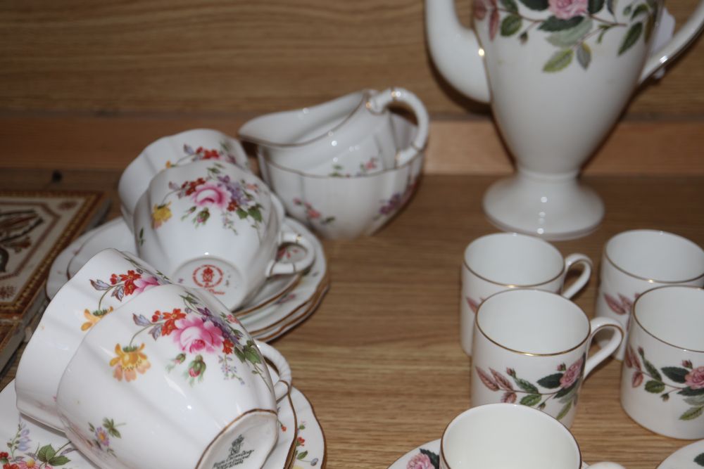 A Royal Crown Derby Derby Posies 25-piece part tea service and a Wedgwood Hathaway Rose part coffee service,